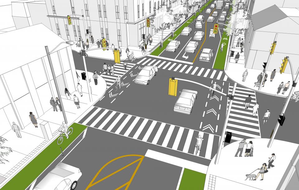 A drawing of a road intersection with bike lanes and pedestrian cross lines